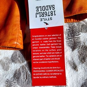 "Excelled" brand. XL Women's Saddle color fine leather jacket.